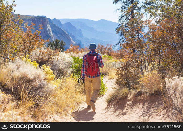 Hike in the autumn mountains. Fall season theme.