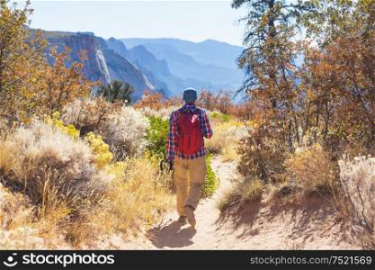 Hike in the autumn mountains. Fall season theme.