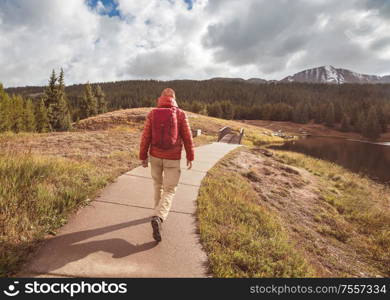 Hike in the autumn mountains. Fall season theme.