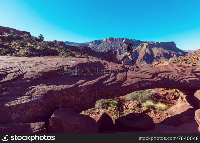 Hike in the Utah mountains. Hiking in unusual natural landscapes. Fantastic forms sandstone formations.