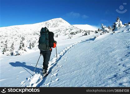Hike in winter mountain