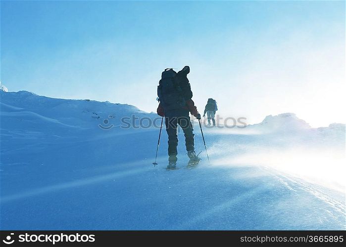 Hike in winter mountains