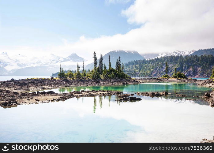 Hike to turquoise waters of picturesque Garibaldi Lake near Whistler, BC, Canada. Very popular hike destination in British Columbia.