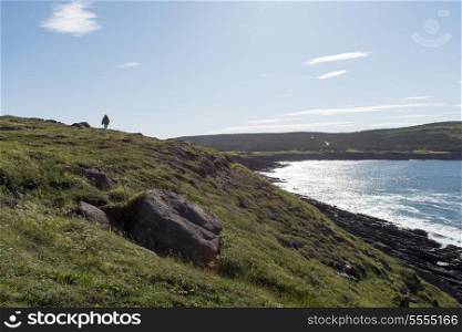 Hiker at coast, Cape Spear, St. John&rsquo;s, Newfoundland And Labrador, Canada