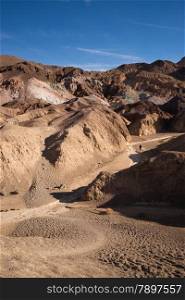 Hiker comes down a wash in Death Valley