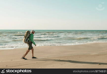 Hiker man  in hike along sea coast