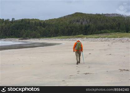 Hiker on the beach on Vancouver island, British Columbia, Canada