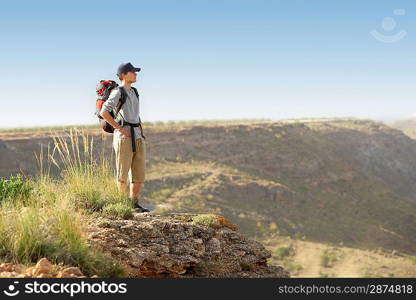 Hiker on Top of Mountain Range
