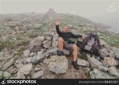 Hiker taking a break during mountain climbing