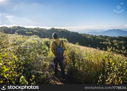 hiker walking on the mountain. success, freedom,travel and adventure concept