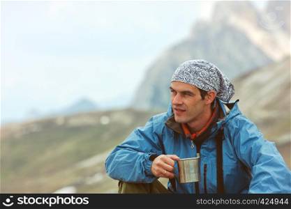 hiker with the high rocky mountains at the background