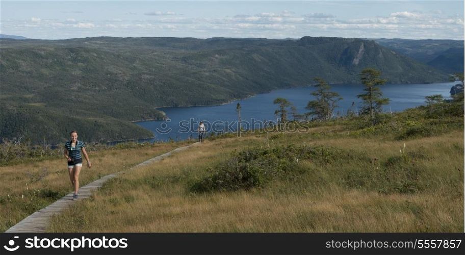 Hikers at Lookout Trail, Lookout Hills, Bonne Bay, Gros Morne National Park, Newfoundland And Labrador, Canada