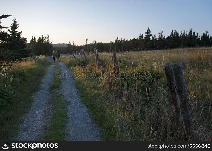Hikers at Skerwink Trail, Port Rexton, Bonavista Peninsula, Newfoundland And Labrador, Canada