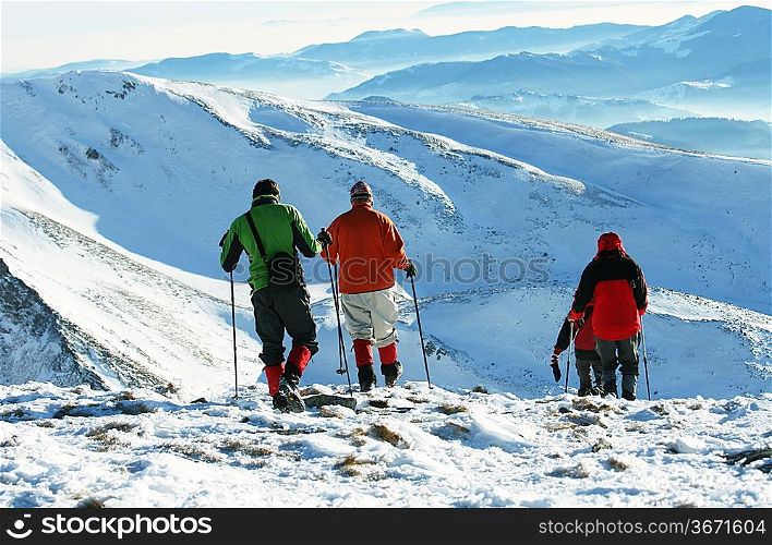hikers in winter mountain