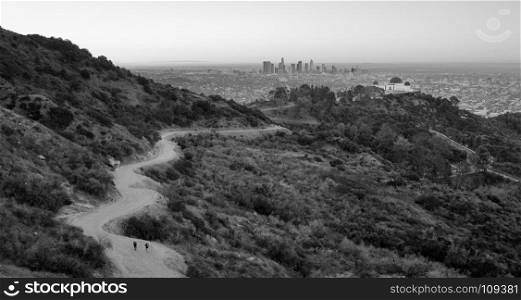 Hikers leave the lot at Griffith Observatory walking to Dante's View in Los Angeles
