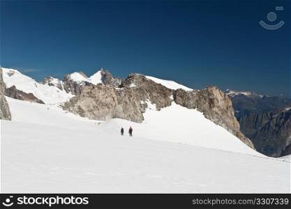 hikers on Mer de Glace glacier, Mont Blanc massif