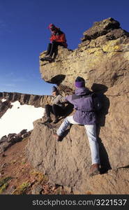 Hikers Resting on a Rock