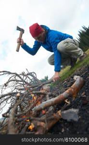 hiking adventure, hiking man try to light fire, collecting woods for fire