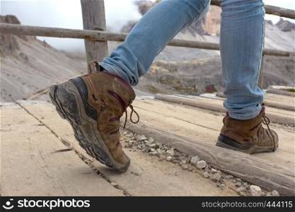 hiking boots close-up. tourist walking on the trail. Italy