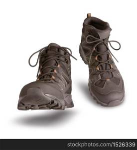 Hiking boots walking on white background, outdoor trekking activity concept