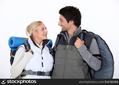 Hiking couple with kit
