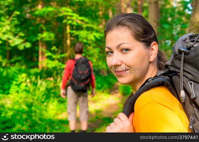 hiking in summer forest with good cheer