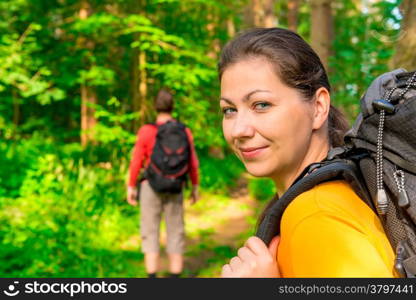 hiking in summer forest with good cheer