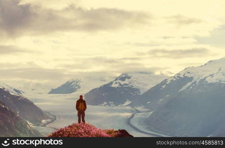 Hiking man in Canadian mountains. Hike is the popular recreation activity in North America. There are a lot of picturesque trails.