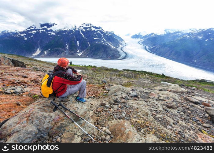 Hiking man in Canadian mountains. Hike is the popular recreation activity in North America. There are a lot of picturesque trails.