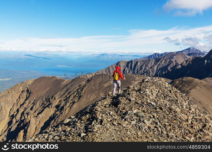 Hiking man in Canadian mountains. Hike is the popular recreation activity in North America. There are a lot of picturesque trails.