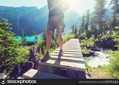 Hiking man in Canadian mountains. Hike is the popular recreation activity in North America. There are a lot of picturesque trails.