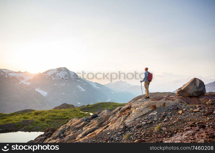 Hiking man in Canadian mountains. Hike is the popular recreation activity in North America. There are a lot of picturesque trails.