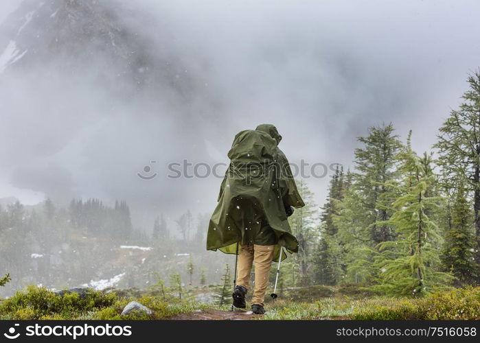 Hiking man in Canadian mountains. Hike is the popular recreation activity in North America. There are a lot of picturesque trails.