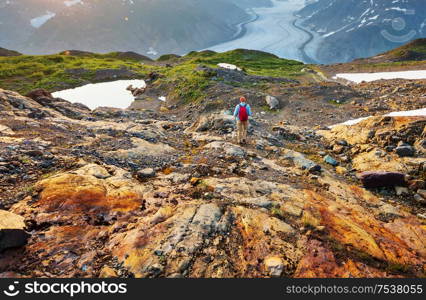 Hiking man in Canadian mountains. Hike is the popular recreation activity in North America. There are a lot of picturesque trails.