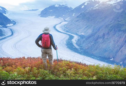 Hiking man in Canadian mountains. Hike is the popular recreation activity in North America. There are a lot of picturesque trails.