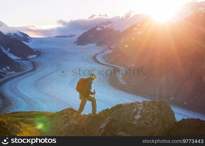 Hiking man in Canadian mountains. Hike is the popular recreation activity in North America. There are a lot of picturesque trails.