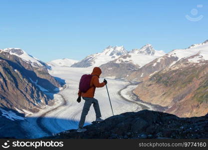 Hiking man in Canadian mountains. Hike is the popular recreation activity in North America. There are a lot of picturesque trails.