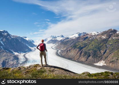 Hiking man in Canadian mountains. Hike is the popular recreation activity in North America. There are a lot of picturesque trails.