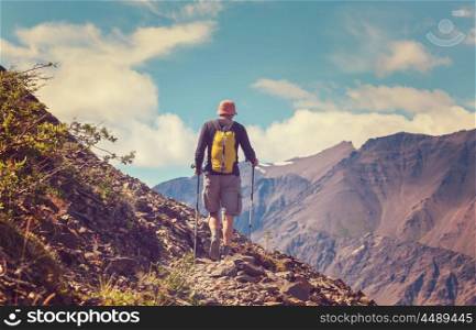 Hiking man in the mountains