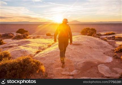 Hiking scene in beautiful summer mountains at sunset