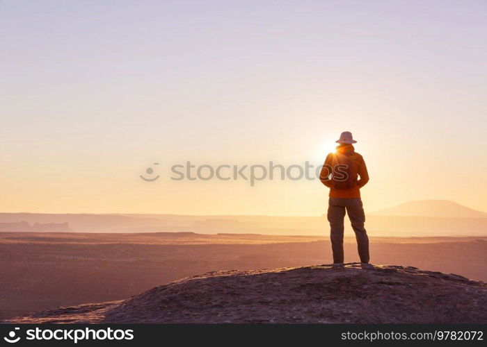 Hiking scene in beautiful summer mountains at sunset