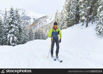 Hiking ski uphill alone in the alps