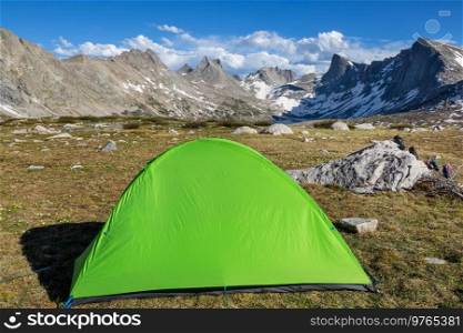 Hiking tent in the mountains in summer season