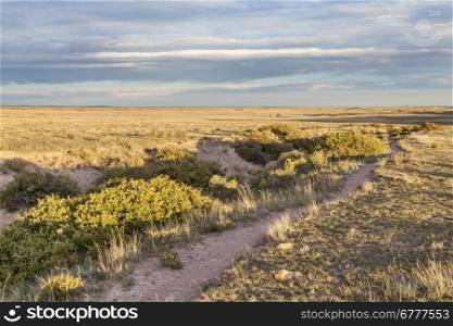 hiking trail and arroyo in Colorado prairie - Soapstone Prairie Natural Area near Fort Collins - fall scenery