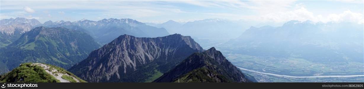 Hiking trail in Lichtenstein with view of valley and Rein