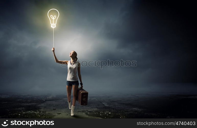 Hiking traveling. Young woman hiker walking with suitcase in hand