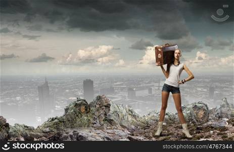 Hiking traveling. Young woman hiker walking with suitcase on shoulder