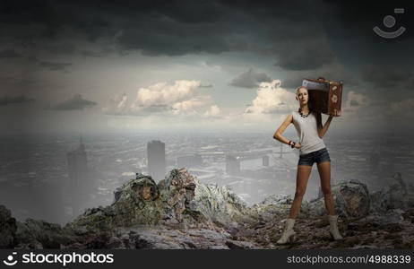 Hiking traveling. Young woman hiker walking with suitcase on shoulder