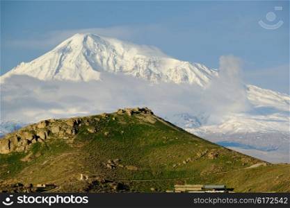 Hill landscape at morning in Armenia with Ararat mountain at background
