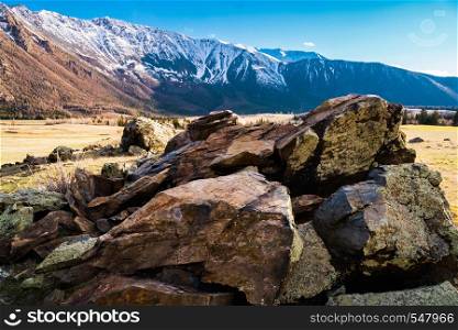 hill textured stones on the background of the Altai mountain valley. Altai mountains landscape.. hill textured stones on the background of the Altai mountain valley. Altai mountains landscape